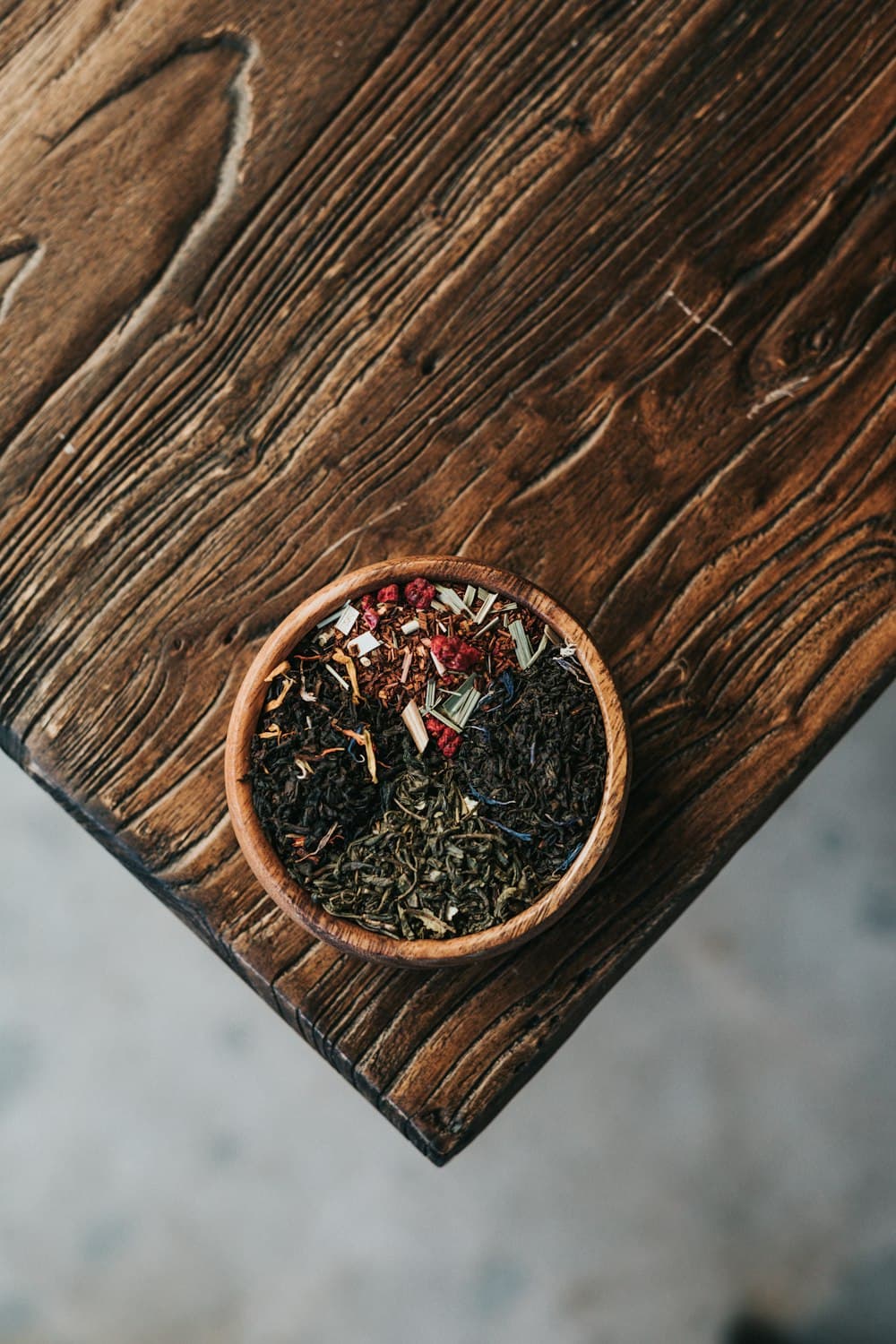 Ground spice powder filling a brown earthenware bowl